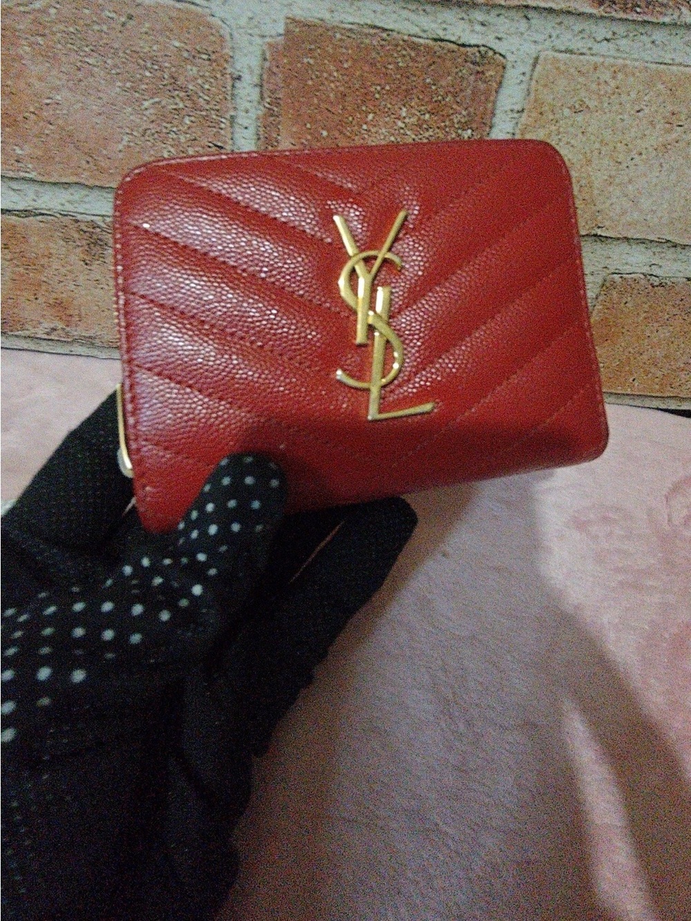 Saint Laurent red chevron leather zip-around card wallet with gold YSL logo